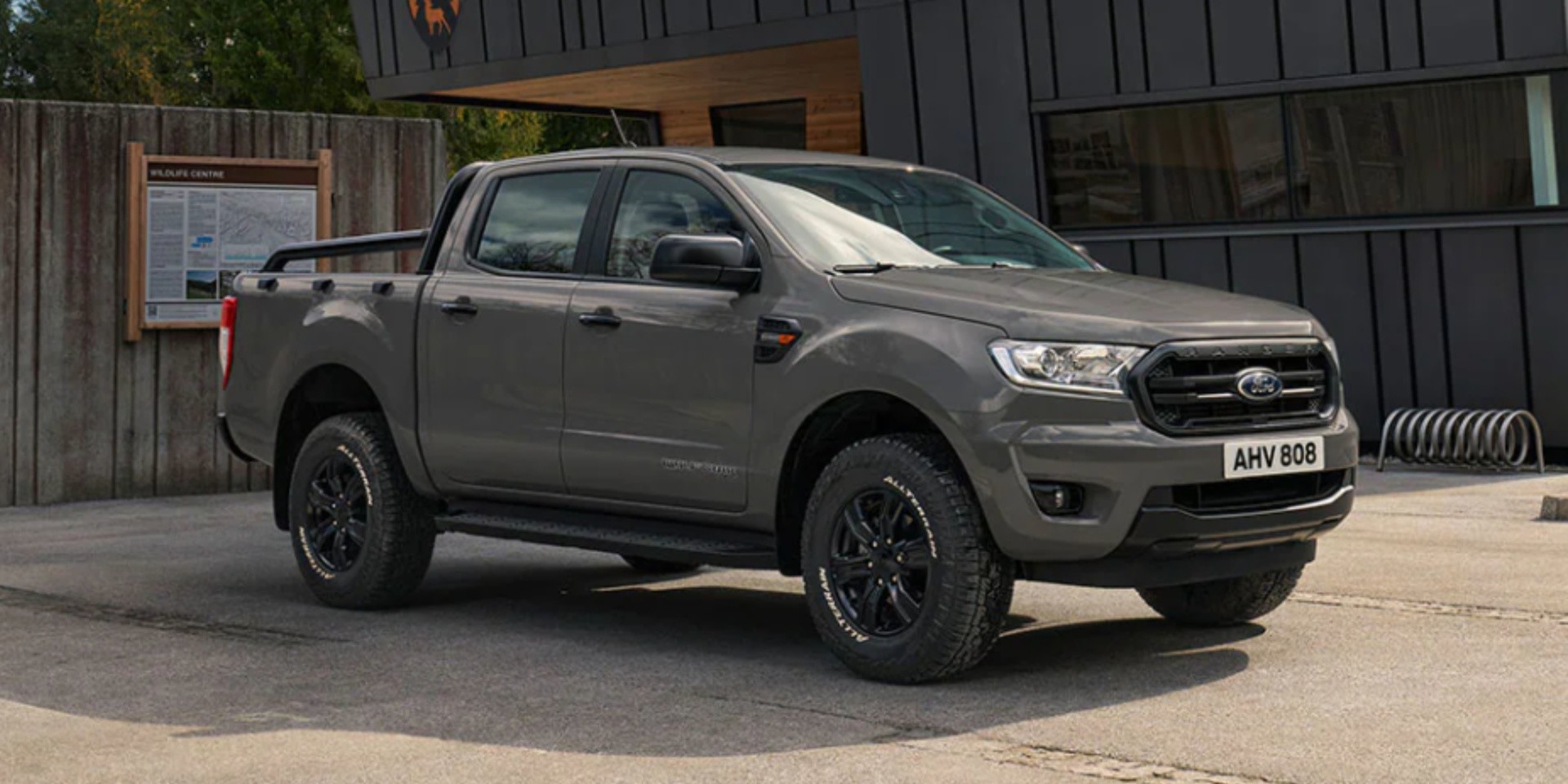 grey ford ranger parked next to house side view